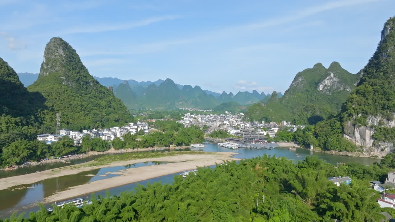 Drone rising from the ancient town, revealing the Xingping village, in China