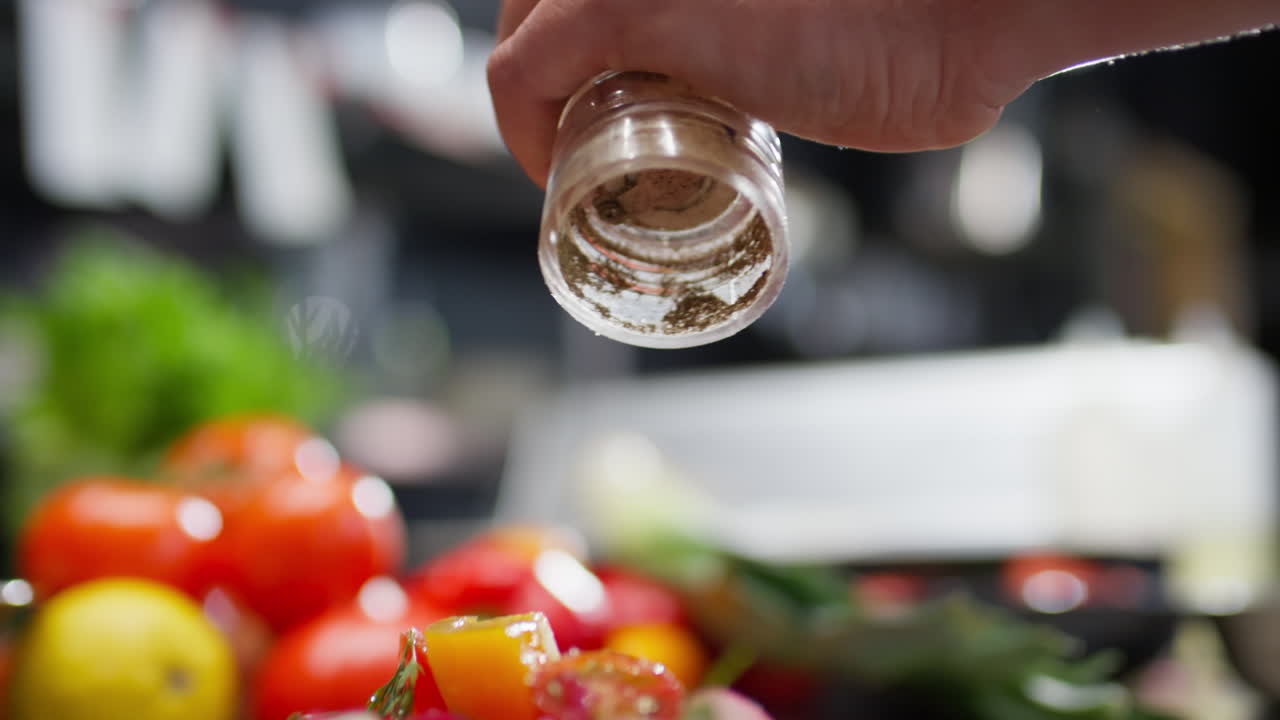 Adding Spices to Fresh Vegetable Salad