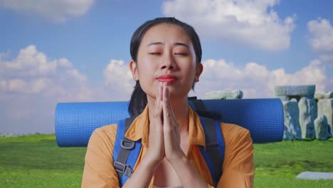 upset tourist praying at stonehenge