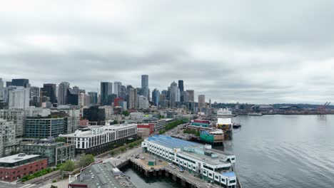 aerial view of seattle's waterfront slowly approaching a large docked cruise ship