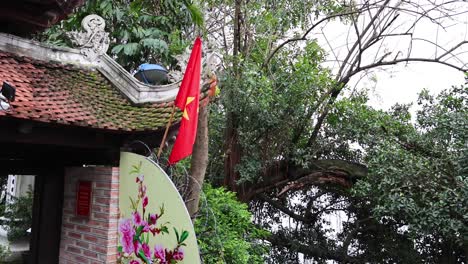 vietnamese flag waving at a temple in hanoi