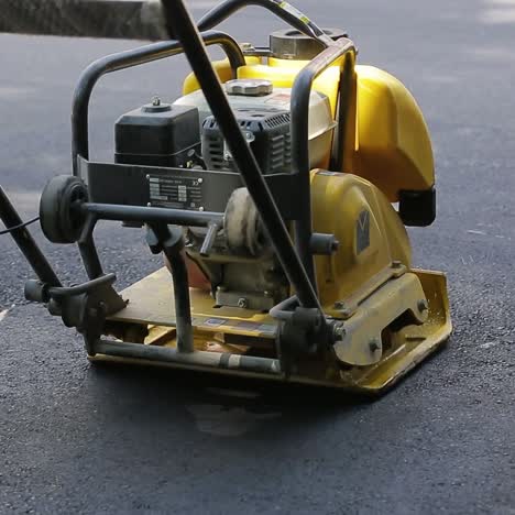 asphalting paver during road
