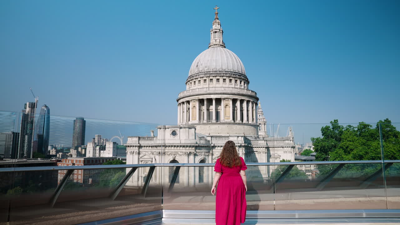 Woman Admiring The St. Paul's Cathedral And Skyline From The Rooftop In London, England, UK. - tilt up shot