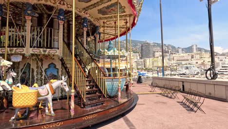 children enjoying a carousel ride by the marina