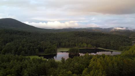 Aerial-reveal-push-into-bass-lake-near-blowing-rock-and-boone-nc,-north-carolina