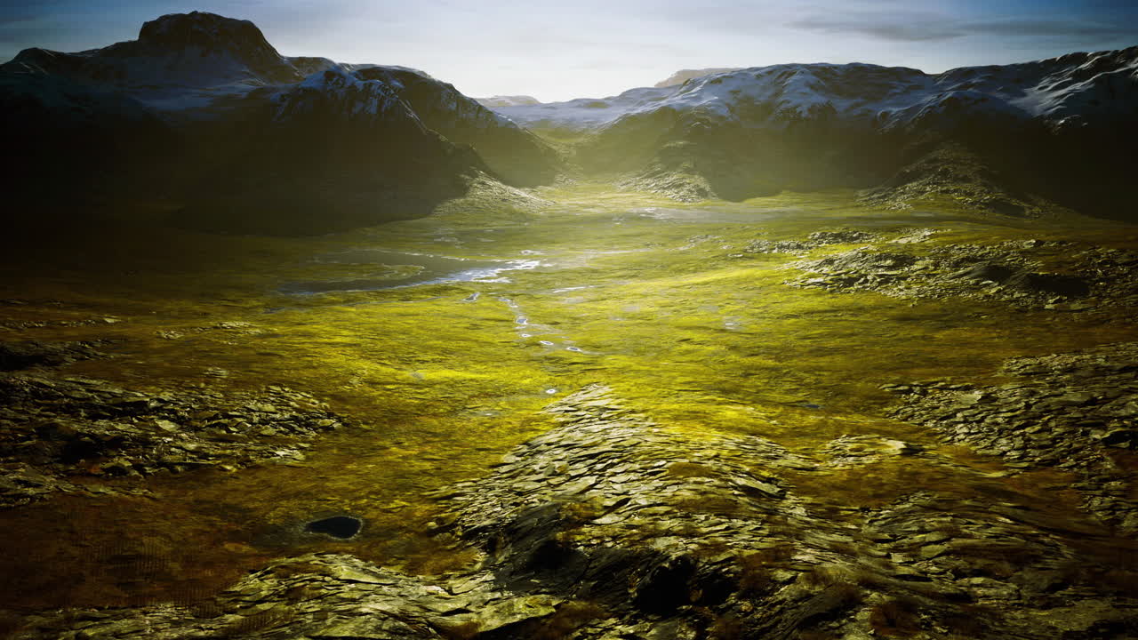 Majestic landscape with mountains and greenery under a bright sky at dawn