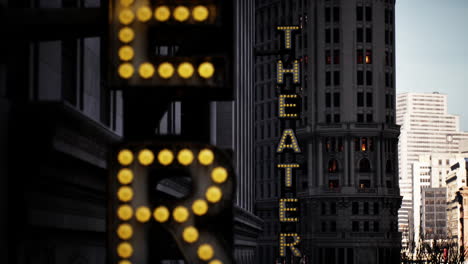 the theater sign at night in the city