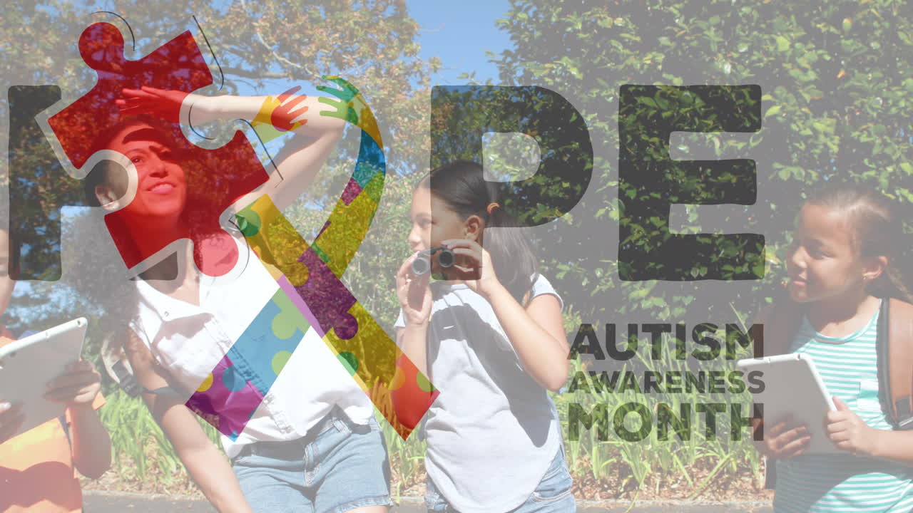 Animation of autism awareness text and colorful puzzle pieces over happy playing children