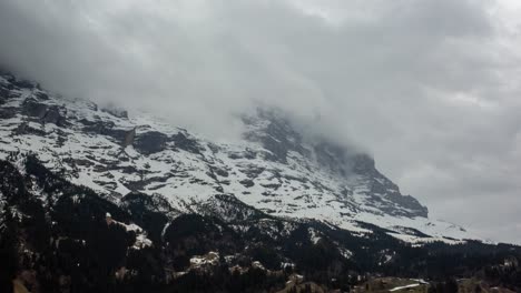 Timelapse-of-fast-moving-clouds-on-the-famous-Eiger-North-Face-seen-from-Grindelwald,-a-stunning-mountain-village-in-Switzerland