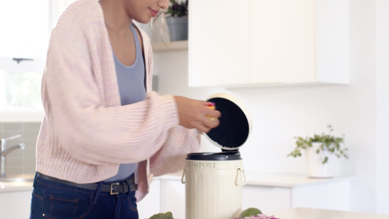 Indian woman composting kitchen scraps at home, promoting eco-friendly living