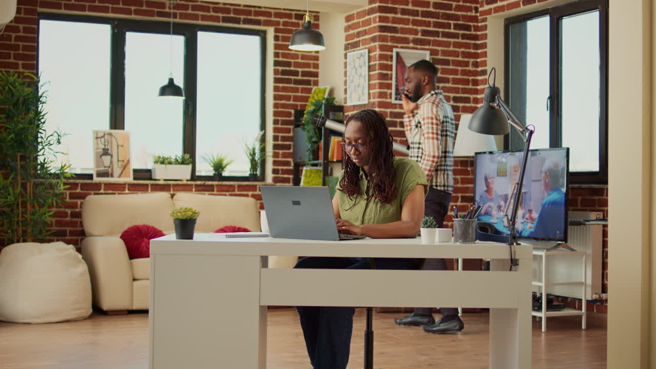 Female freelancer working from home on laptop