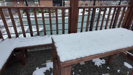 snowy outdoor wooden table and benches