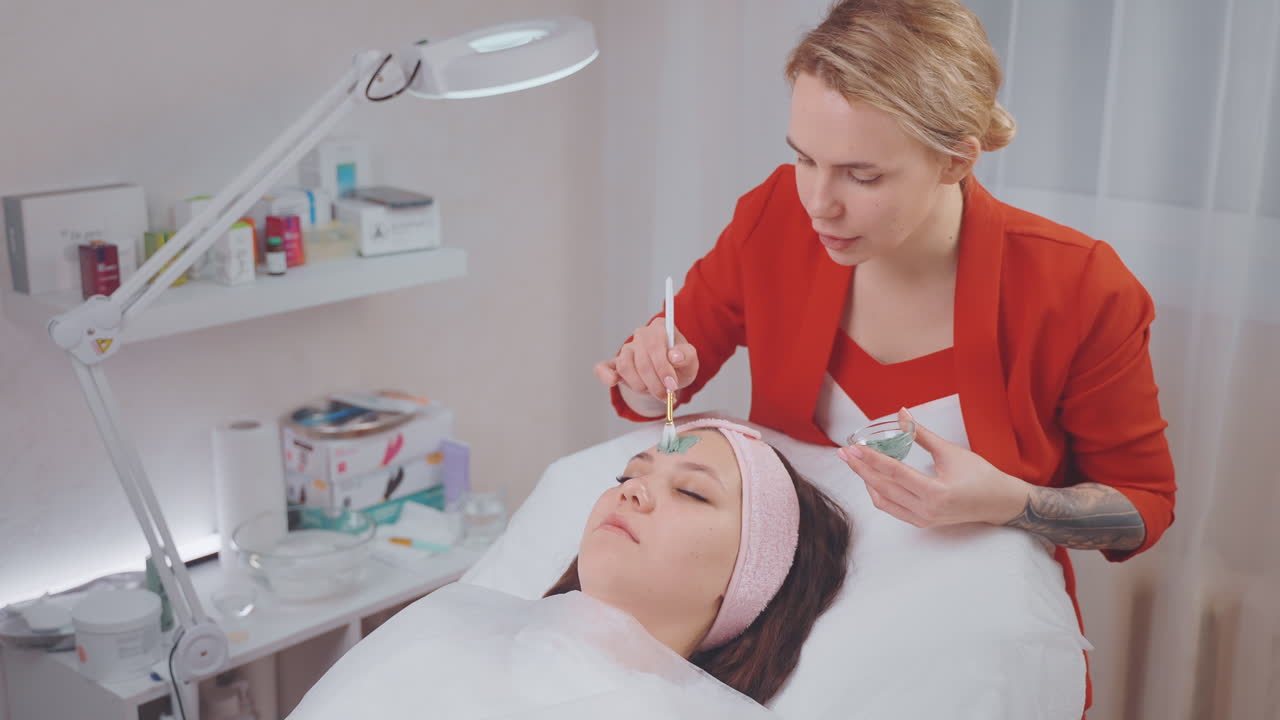 Woman getting a facial mask treatment