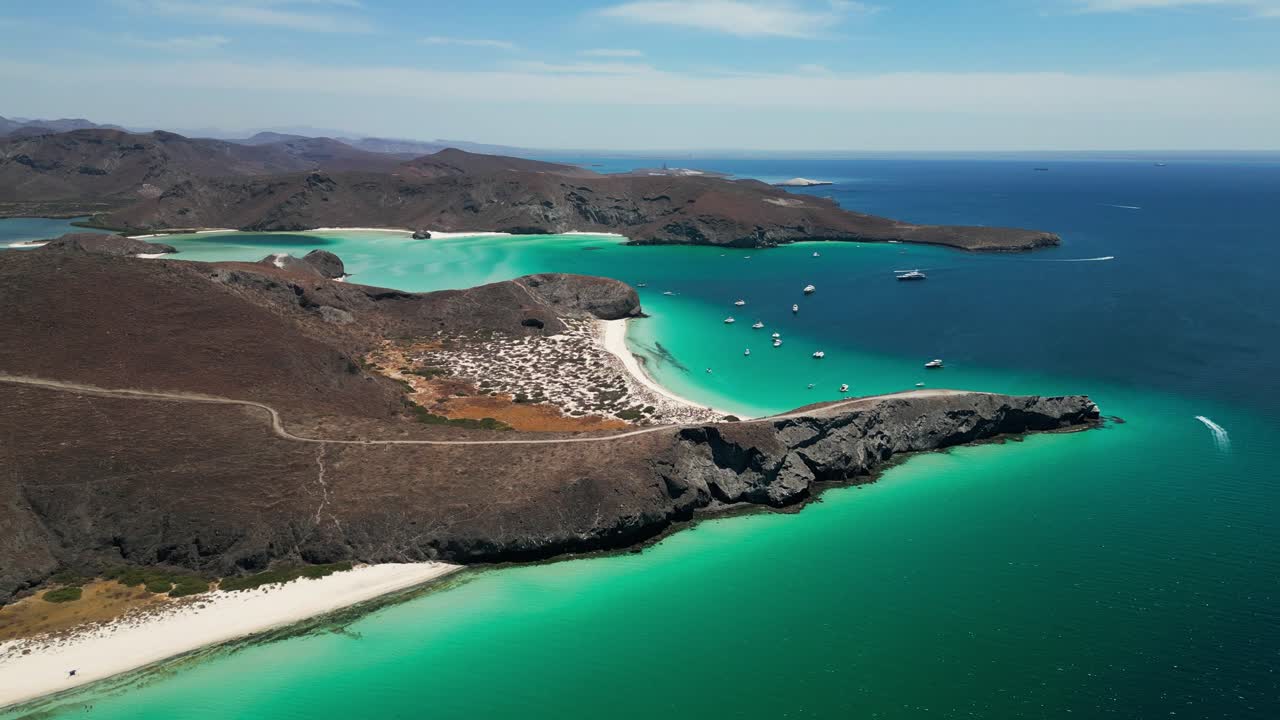 Tecolandra beach in la paz, mexico with clear blue waters and boats, aerial view
