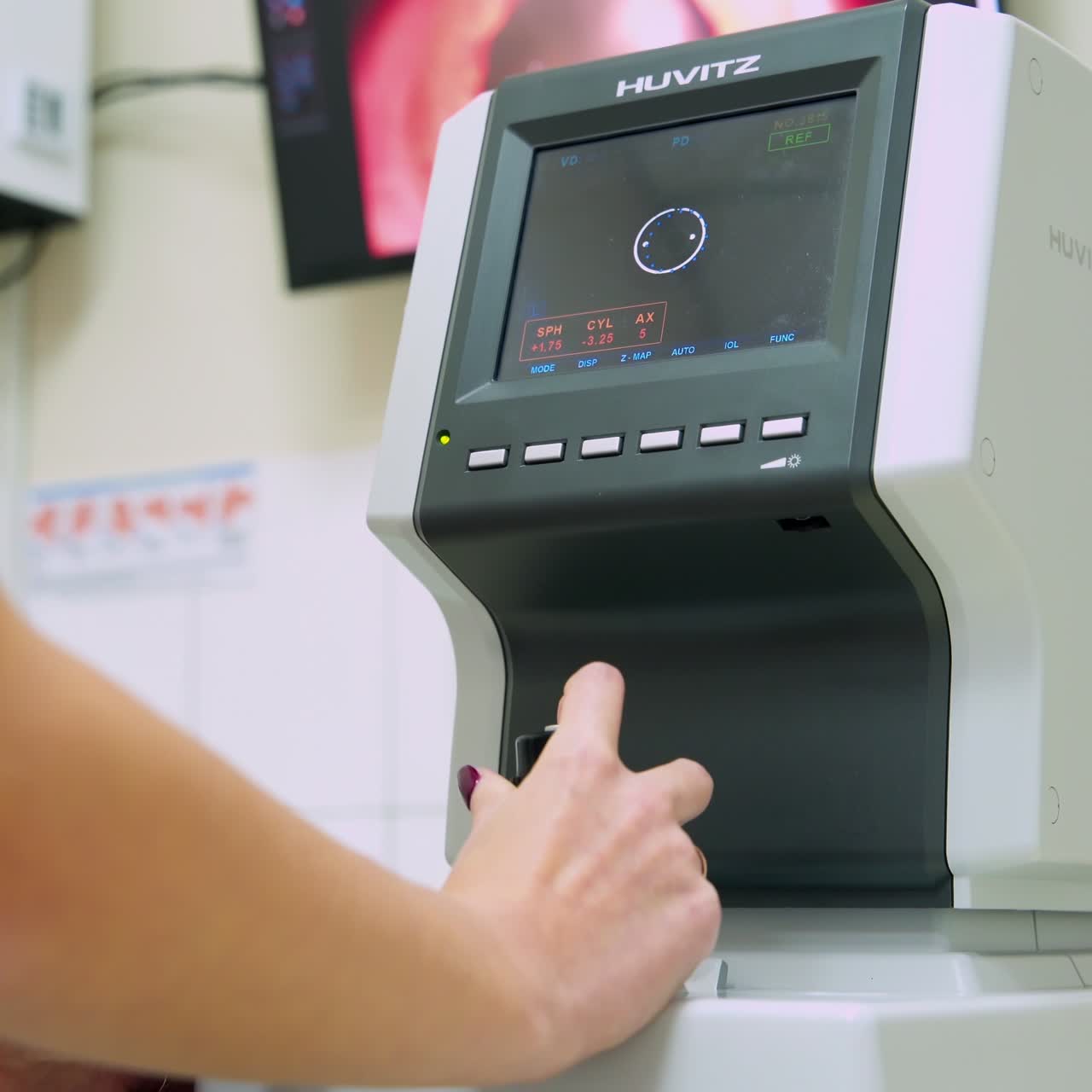Female ophthalmologist using apparatus