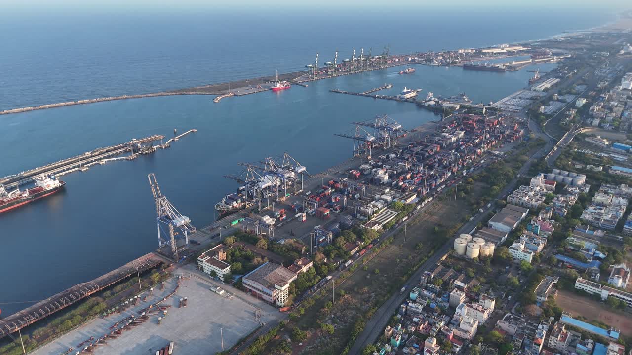 Deep harbor basin with anchored vessels and port infrastructure from above