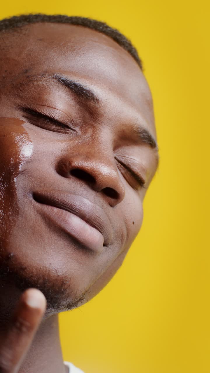 Man applying skincare product on his face