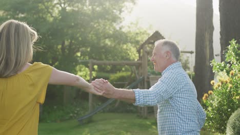 senior couple dancing outdoors