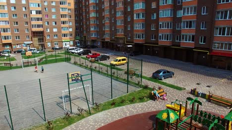 modern apartment buildings in an urban place. comfortable children playgrounds and car parking near residential buildings in the new district.