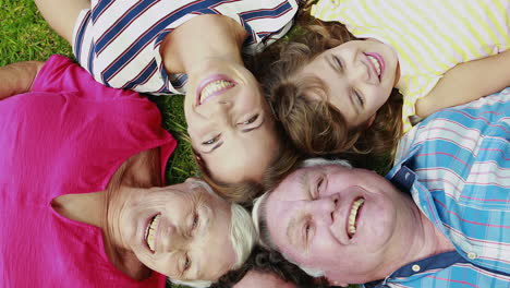 extended family lying in circle