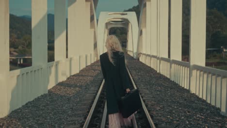 woman walking on a bridge