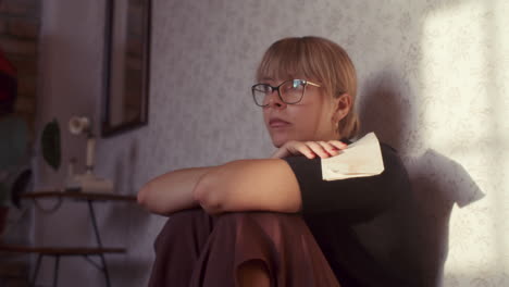 woman sitting on floor in a vintage room