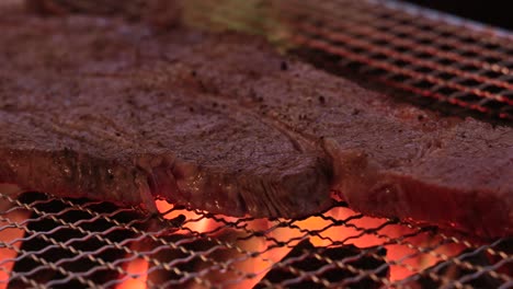 a delicious steak grilled over charcoal