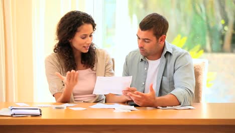 Young-couple-trying-to-sorti-out-their-accounts