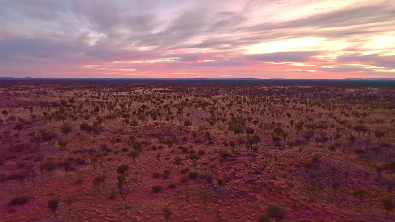 Pannign right over the outback desert landscape during a stunning sunrise