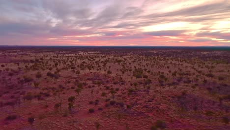 pannign right over the outback desert landscape during a stunning sunrise