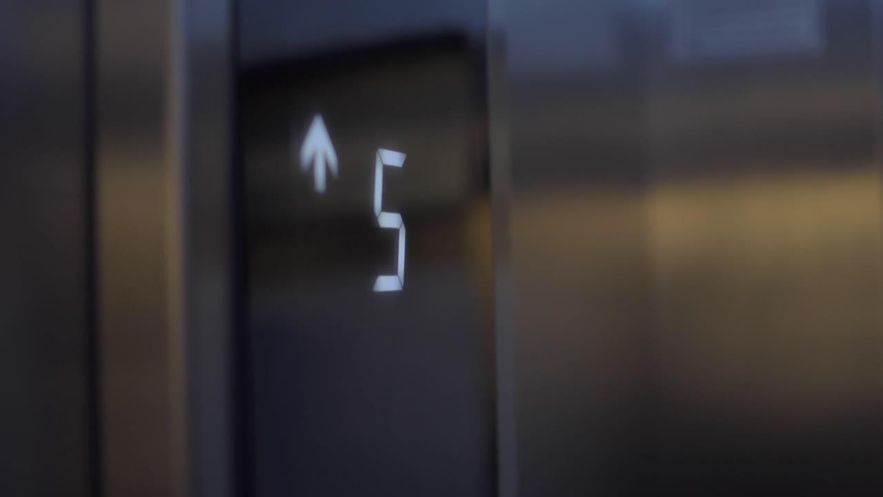 Elevator Digital Display Showing Floor Number Changing from Four to Five