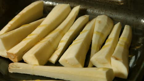 chopped parsnips with olive oil drizzled on top