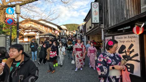 crowded street with people in kimonos and modern attire