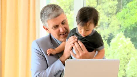 Businessman-working-on-his-laptop