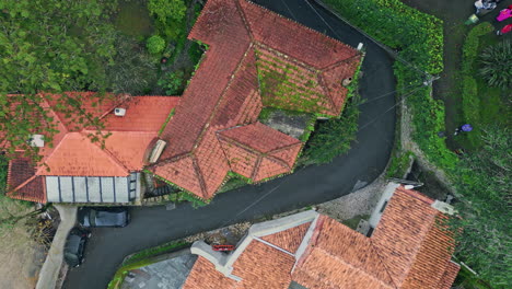 old rooftops touristic town and winding roads top view. medieval city in nature