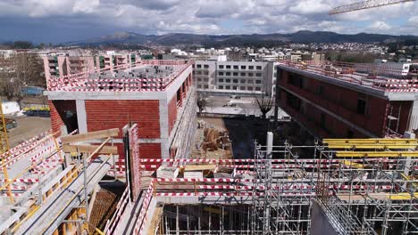 Building-Construction-With-Cranes-Aerial-View