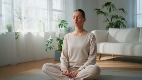 woman meditating peacefully at home