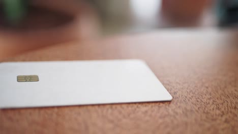 white credit card on wooden table