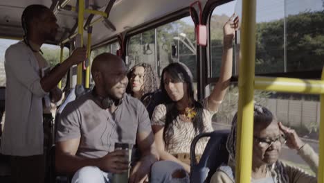 diverse group of people enjoying a ride on a public bus