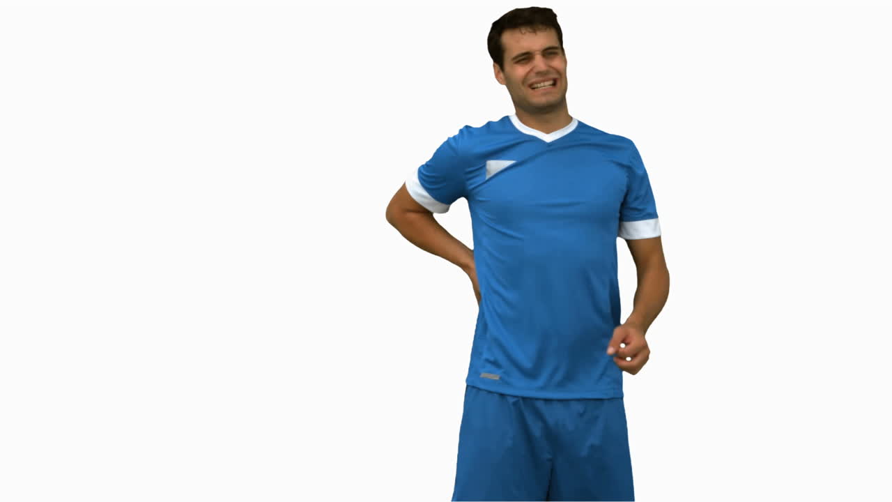 jogador de futebol sofrendo de dor nas costas na tela branca