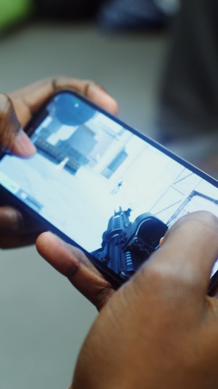 Playing a first person shooter game on a smartphone