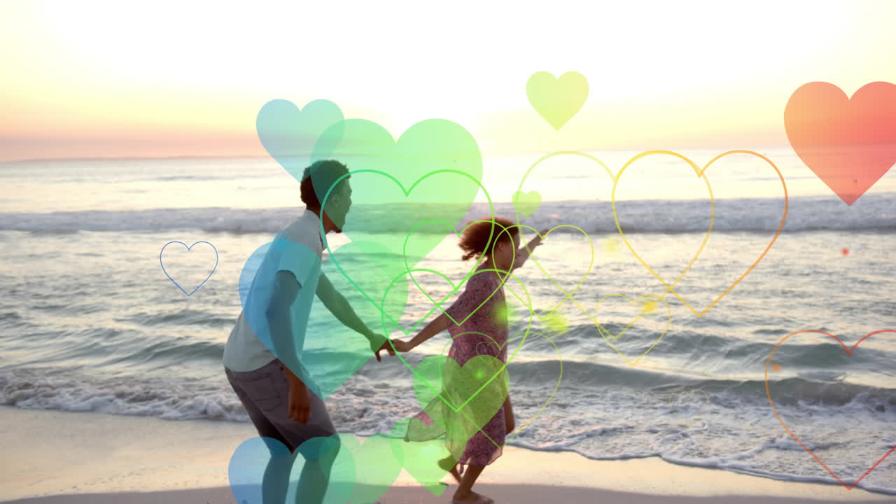 여름에 해변에서 춤을 추는 사랑에 빠진 다양한 커플을 가로질러 움직이는 마음의 애니메이션