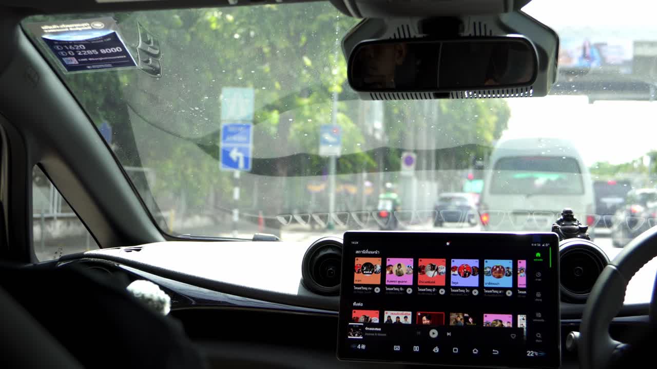 Handheld shot from car rear, drive during rush hour in Bangkok, Thailand