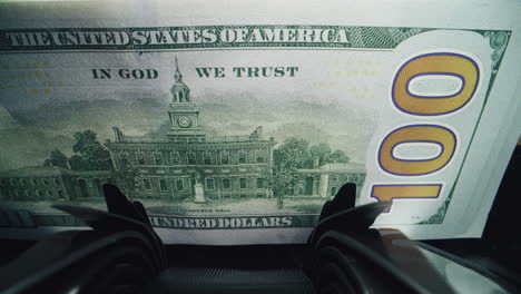 counting hundred dollar bills
