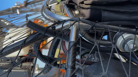 vertical format: close-up detail of paramotor paraglider steel frame