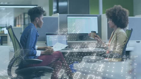two people discussing in office with binary code animation overlay