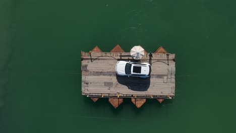 one car crossing river in a barge, butrint , albania