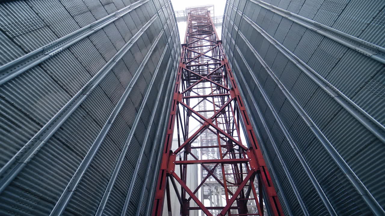 Large gray tanks for grain. Large gray metal tanks for storage of grain