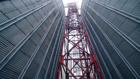 large gray tanks for grain. large gray metal tanks for storage of grain
