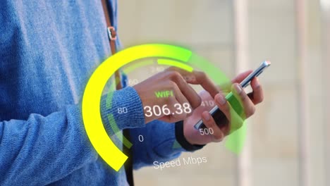 Animation-of-yellow-speedometer-over-hands-of-caucasian-man-using-smartphone